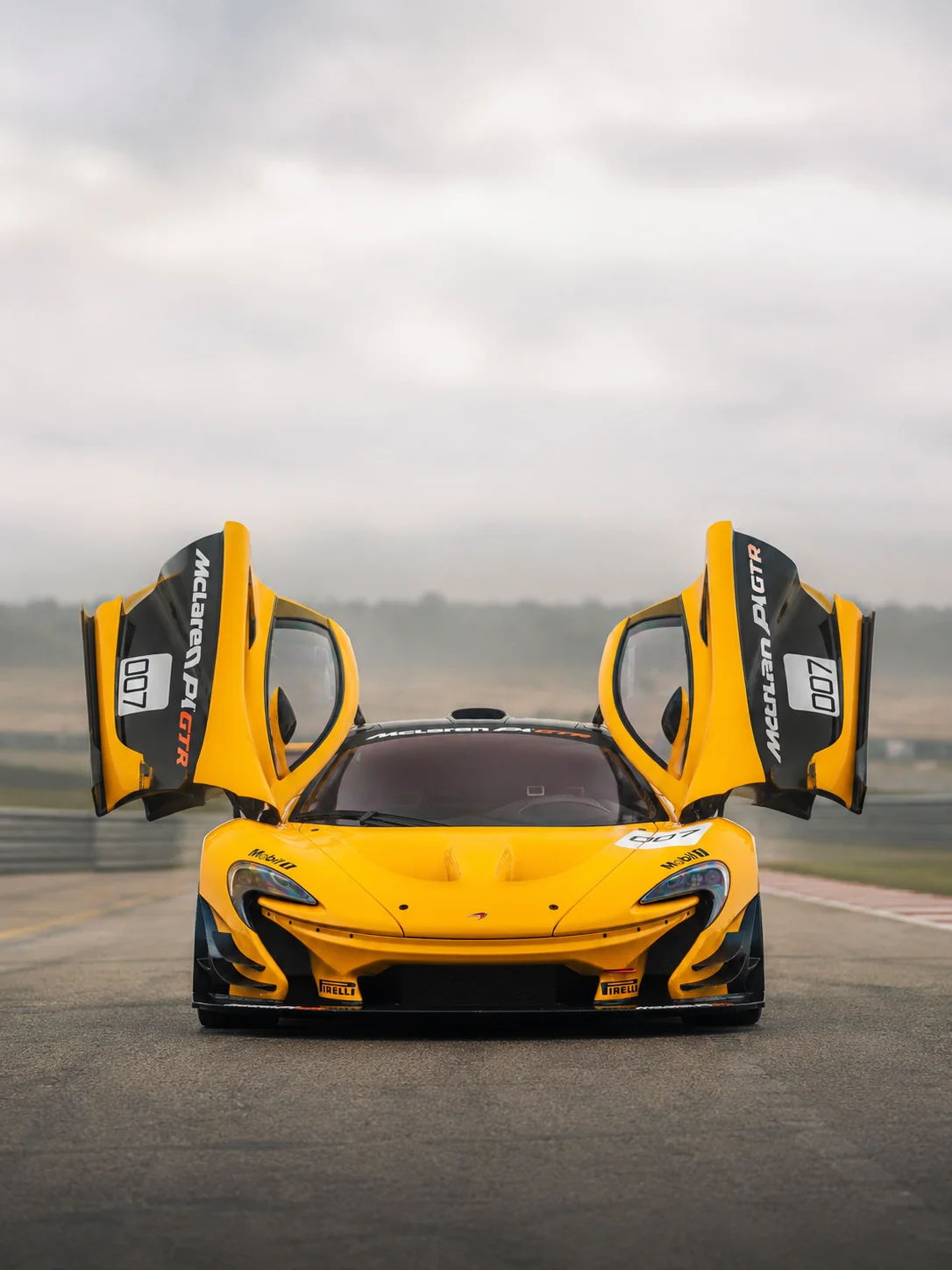 McLaren P1 GTR on circuit, rear three-quarter with fixed wing